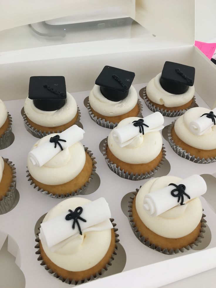 Graduation cupcakes topped with caps and diplomas