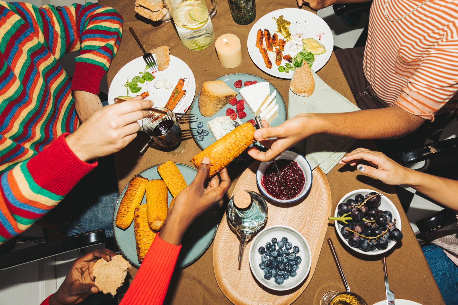 Friends eating together at a Thanksgiving party